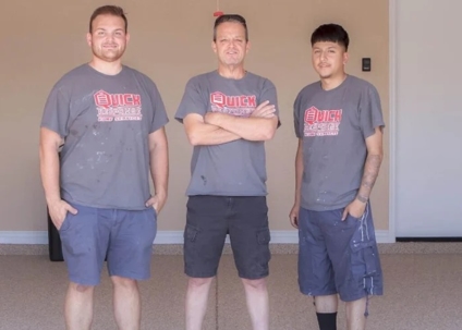 3 men in grey tshirts