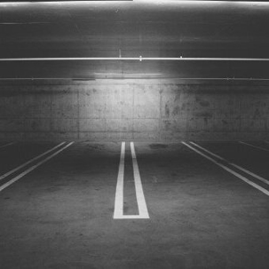 parking space marked with what appears to be reflective pavement marking tape