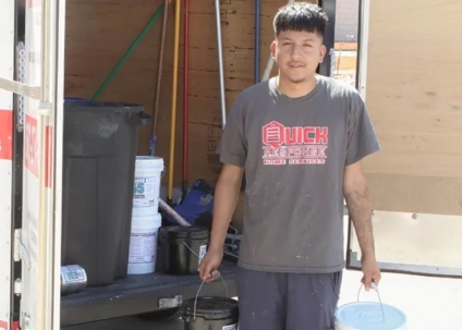 man holding buckets